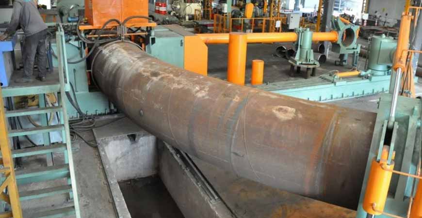 Hot induction bends for pipeline service